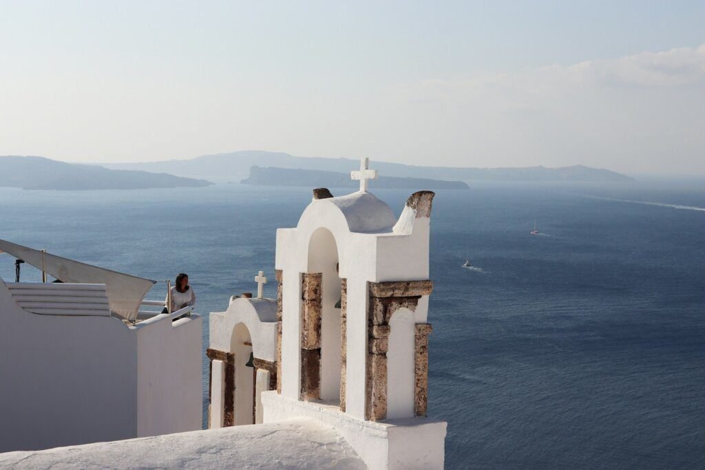 a white building with a cross on the top of it